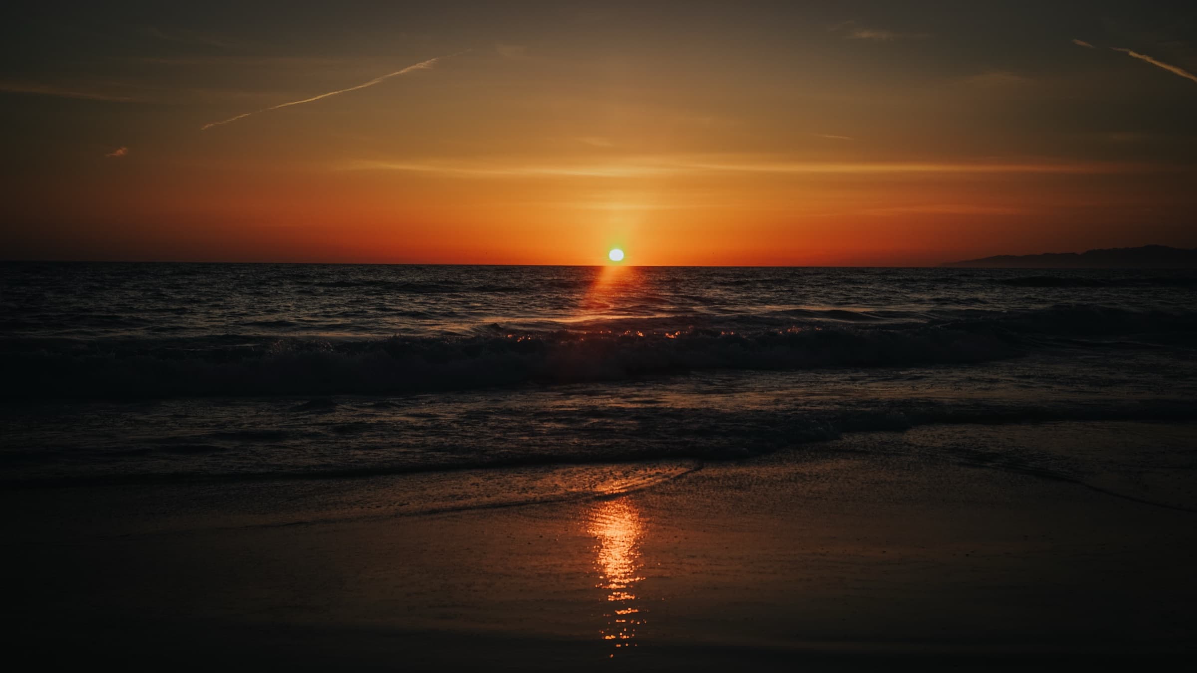 The sun setting into the sea