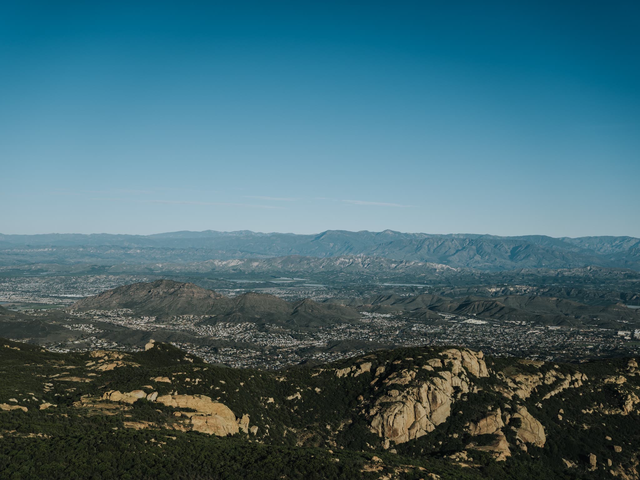 The valley from the ridge, ranges stacked behind